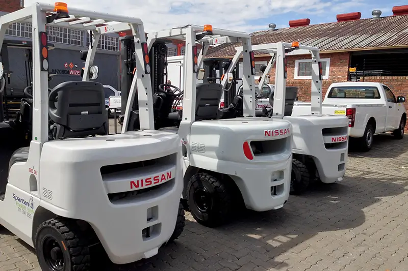 Clearing Shipment Forklift Hire operating forklift in warehouse